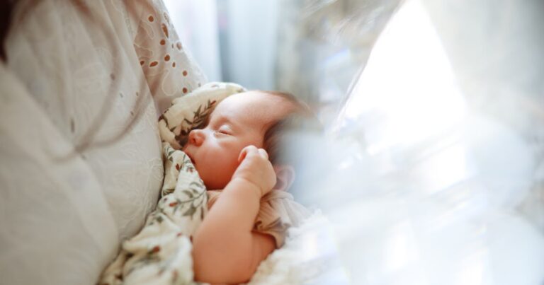 sleeping newborn girl in