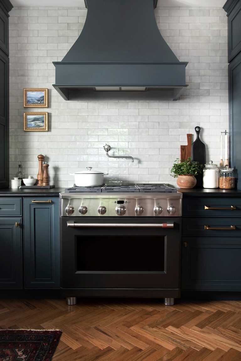 Black Industrial Range with Teal Cabinetry